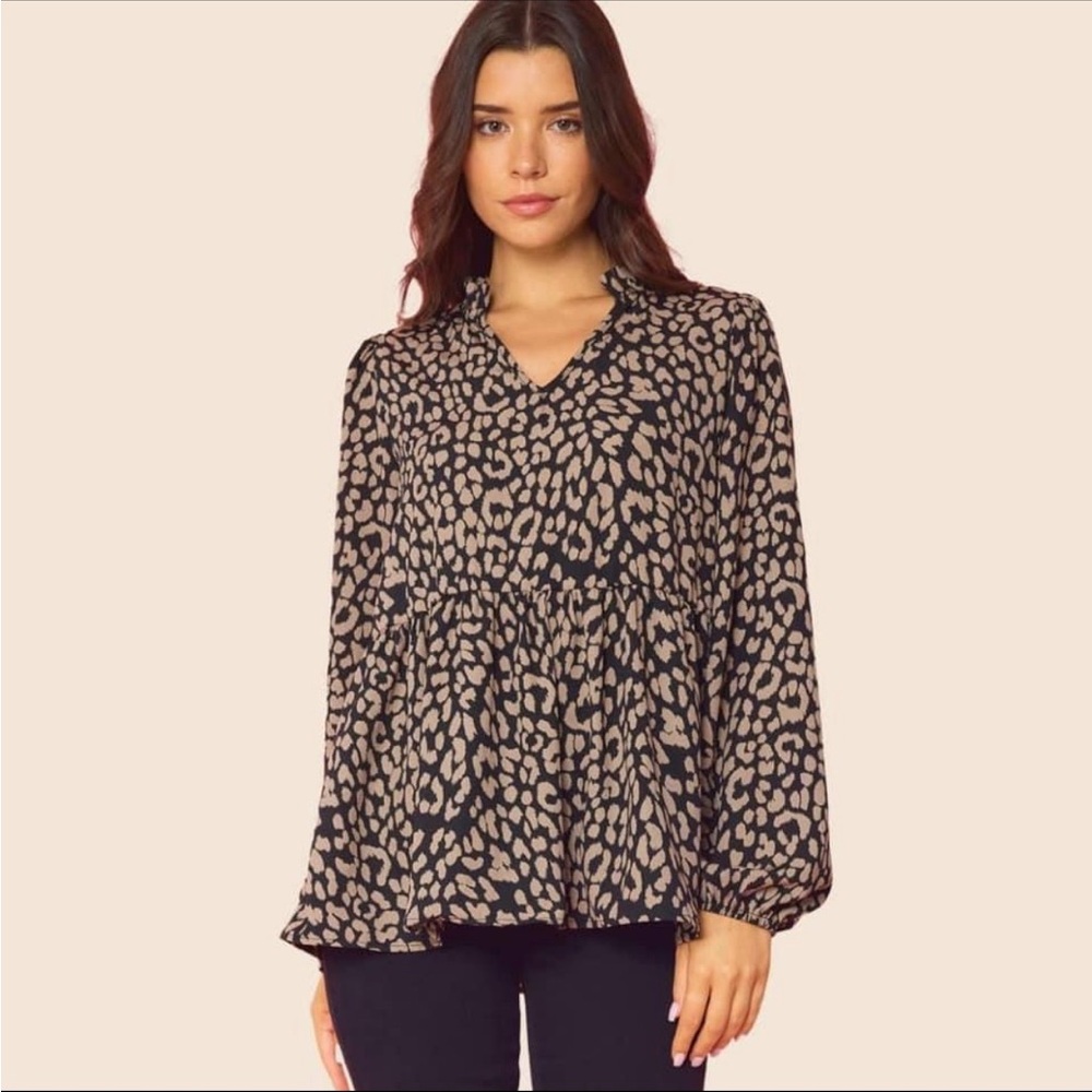size medium leopard printed peplum long sleeve top with ruffle collar